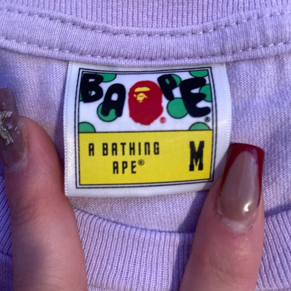 Bape Shark Mouth T shirt. A lavender color, size medium, and is unisex - Picture 3 of 4